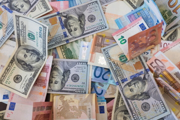 Fototapeta na wymiar dollar and euro banknotes