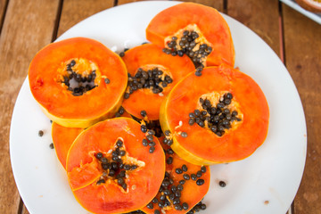 papaya is sliced on a plate