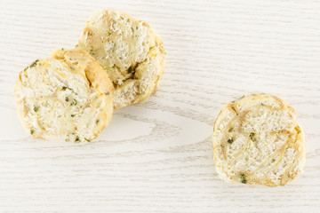 Calsbad bread dumpling top view isolated on grey wood background three slices fresh steamed.
