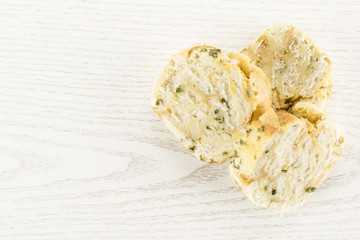Calsbad bread dumpling top view isolated on grey wood background three slices stack fresh steamed.