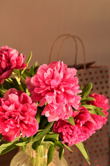 Sunny fresh bunch of pink peonies peony roses flowers background. Garden spring flowers, Card Concept, copy space for text. mom's day, birthday, celebration wallpaper, copy space.