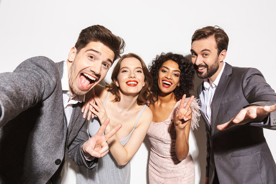 Group of joyful well dressed multiracial people