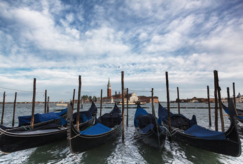 Fototapeta na wymiar Traditional Gondolas in St Marco or Saint Mark's square in Venice
