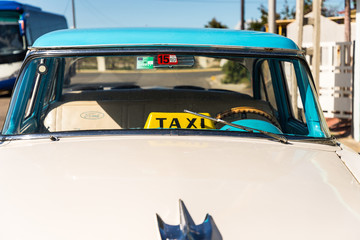 A vintage American car used a a Taxi in cuba