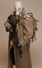 Doomsday man with rifle and pack.