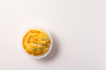 Stuffed chicken pie known as Empada in Portugal and Brazil. One snack over white background, minimalism.