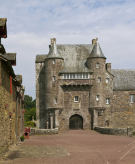 Fototapeta na wymiar The turretted gatehouse of the Chateau de Trecesson