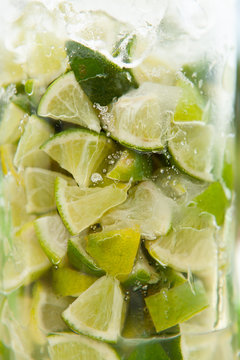 Close-up of lime with ice served in a glass