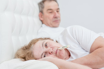 old man with sick wife on the bed