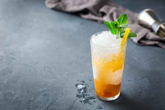 Classic mint julep cocktail with bourbon and ice