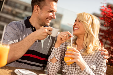 happy couple enjoying a coffee at the coffee shop