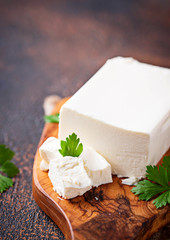 Feta cheese on rusty background