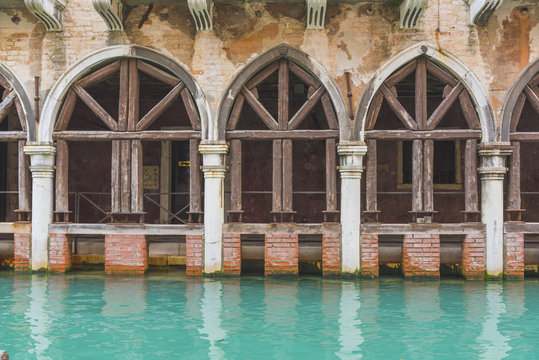 Venice, Veneto, Italy. Old waterfront building along a backstreet canal.