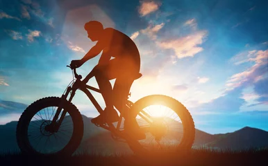 Photo sur Plexiglas Vélo Biker riding his bicycle in the mountains.