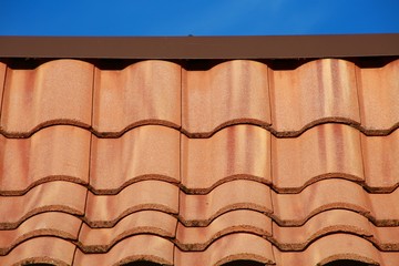 Roof Tiles on Top of Condo against Blue Sky in Florida