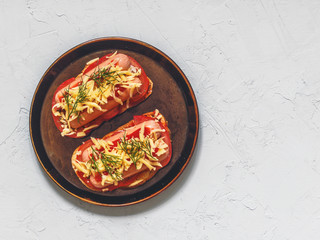 Homemade delicious sandwich with sausage, tomatoes and cheese. Healthy fast food