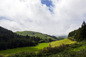 Fototapeta na wymiar Green hill landscape scenery with breathtaking views over the horizon