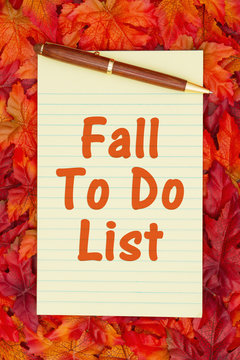 Autumn time To Do List with a yellow notepad and fall leaves