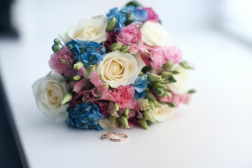 wedding bouquet and wedding rings