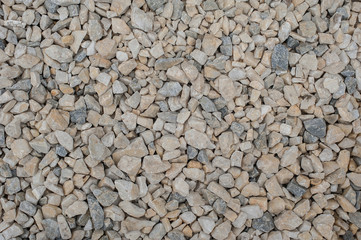 Gravel and pebbles background pattern, small and big sand