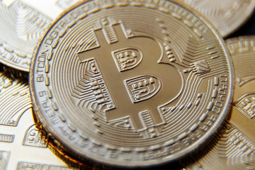 Golden Bitcoins. New virtual money. Shallow depth of field