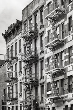Black and white picture of fire escapes, one of the New York City symbols, USA.