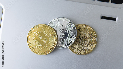 Golden And Silver Bitcoin Coins On A Laptop Digital Crypto Currency Golden And Silver Bitcoin Coins On A Laptop Digital Crypto Currency Virtual Money