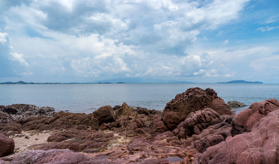 pink stone and seascape with cloudscape