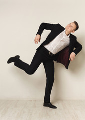 Portrait of young businessman playing marionette