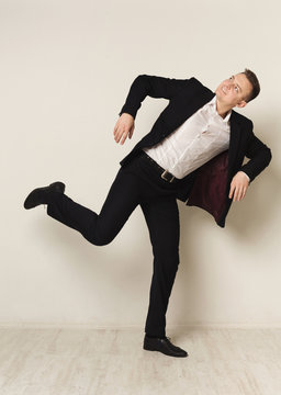 Portrait of young businessman playing marionette