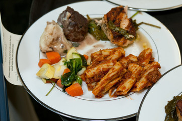 Pasta rigatony with meat sauce, sauteed vegetables, chicken marsala, grilled salmon and beef tenderloin medallions