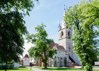 Fototapeta na wymiar Medieval church in a park