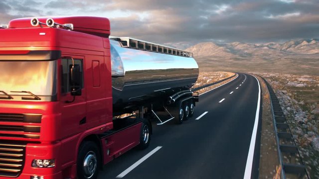 A tank truck passes the camera driving on a highway into the sunset, camera moves from low angle front-view upwards to high angle view as the truck passes. Realistic high quality 3d animation.