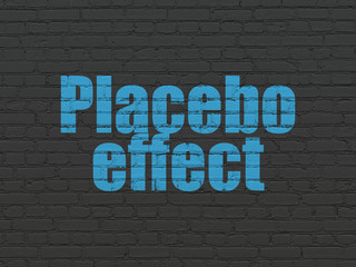 Fototapeta na wymiar Healthcare concept: Painted blue text Placebo Effect on Black Brick wall background