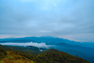 Naklejka na ściany i meble high mountains peaks range clouds in fog scenery landscape national park view outdoor at Chiang Rai, Chiang Mai Province, Thailand
