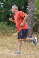 Obraz premium middle aged man in sports uniform warming up