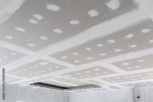 Ceiling Gypsum Board Installation At Construction Site