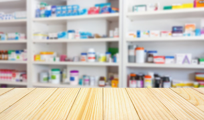 Pharmacy drugstore counter table with blur abstract backbround with medicine and healthcare product on shelves
