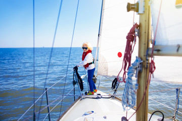 Kids sail on yacht in sea. Child sailing on boat.