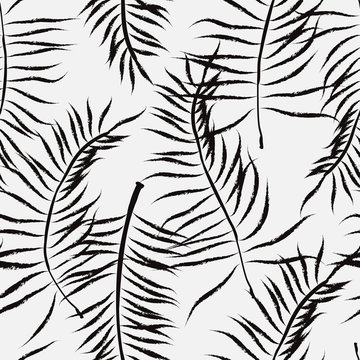Palm leaves silhouette on the white background. Vector seamless pattern