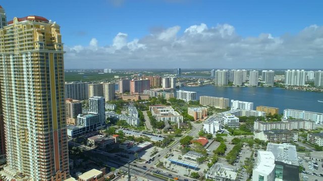 Aerial turning reveal city behing tall buildings