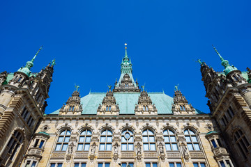 Fototapeta na wymiar Beautiful famous Hamburg town hall building with green colored roof in Altstadt quarter, Hamburg, Germany
