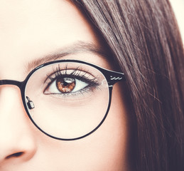 Beautiful young woman wearing glasses. Close up shot.