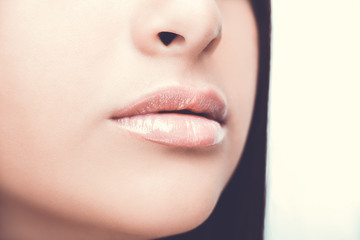 Fototapeta premium Sexy Lips. Beauty Lipgloss Makeup Detail. Beautiful Make-up Close up