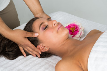 Obraz na płótnie Canvas Hispanic Woman Getting Massage
