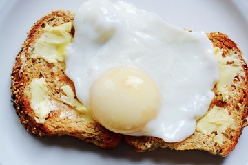 The perfect poached egg on seeded buttered brown toast 