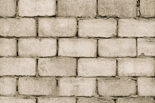 Gray cinder cement block wall of building with cement solution