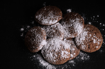 oatmeal cookies on a black table in castor sugar