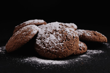 oatmeal cookies on a black table in castor sugar