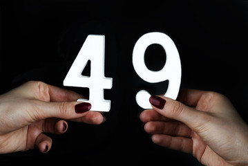 To female hands the number forty-nine.